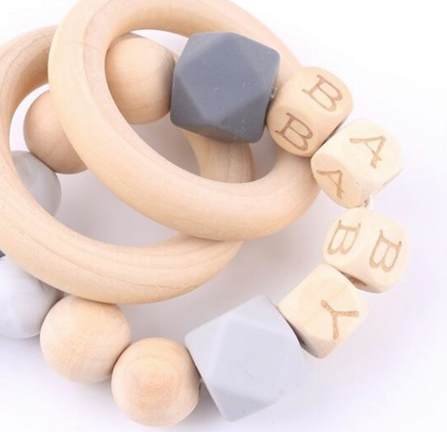 Hochet plumes en bois et silicone
